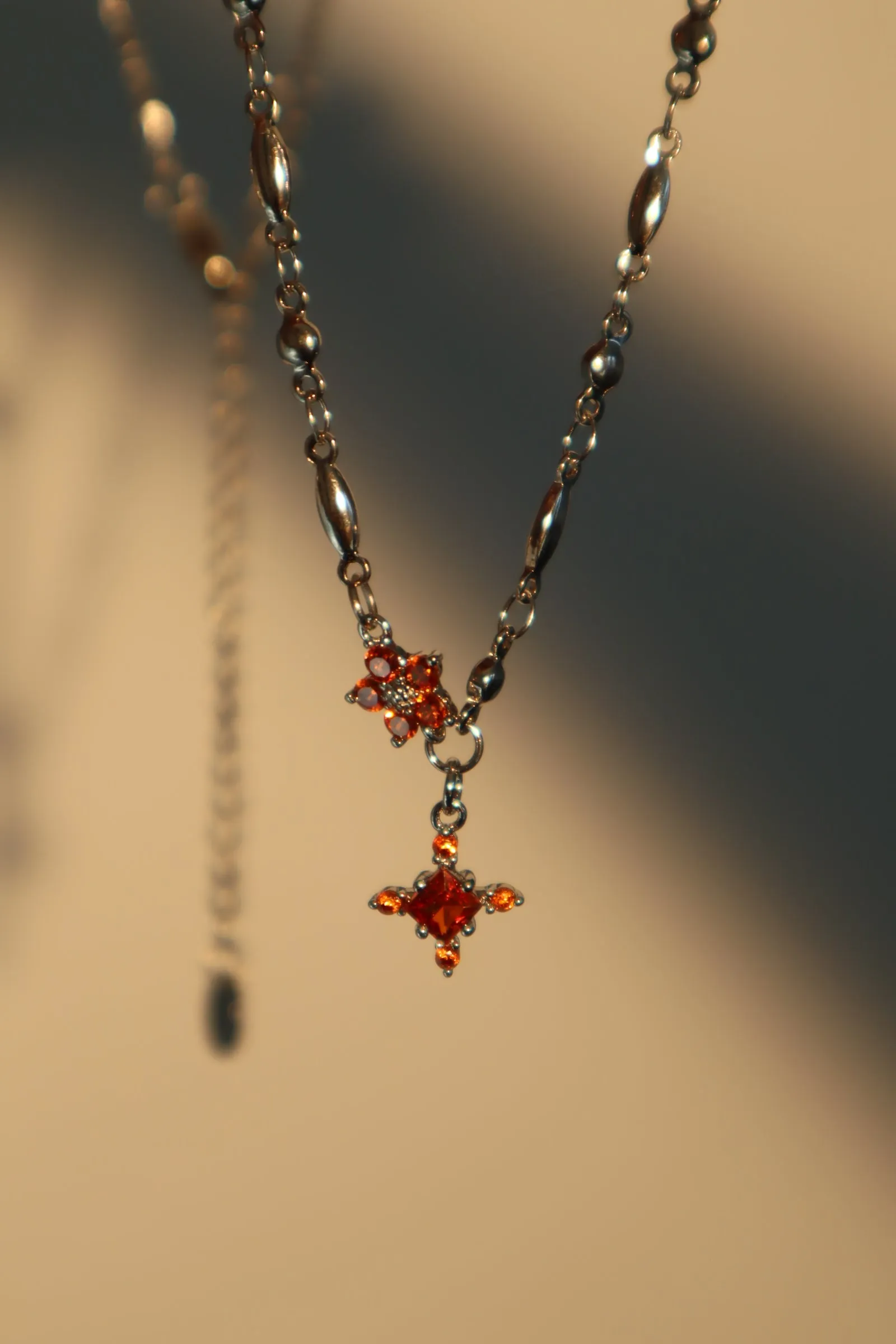 Platinum Plated Garnet Diamond Cross Necklace