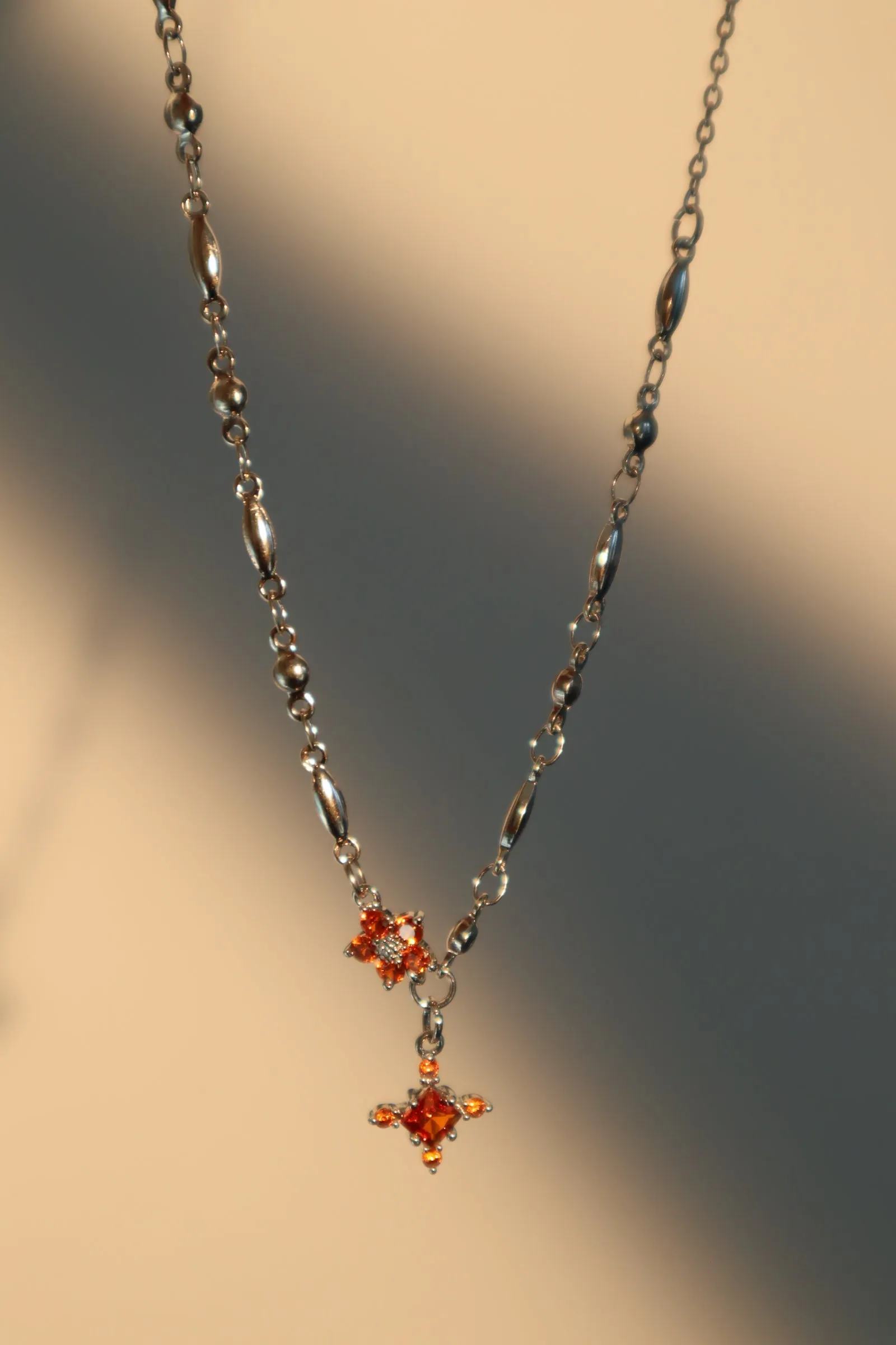 Platinum Plated Garnet Diamond Cross Necklace