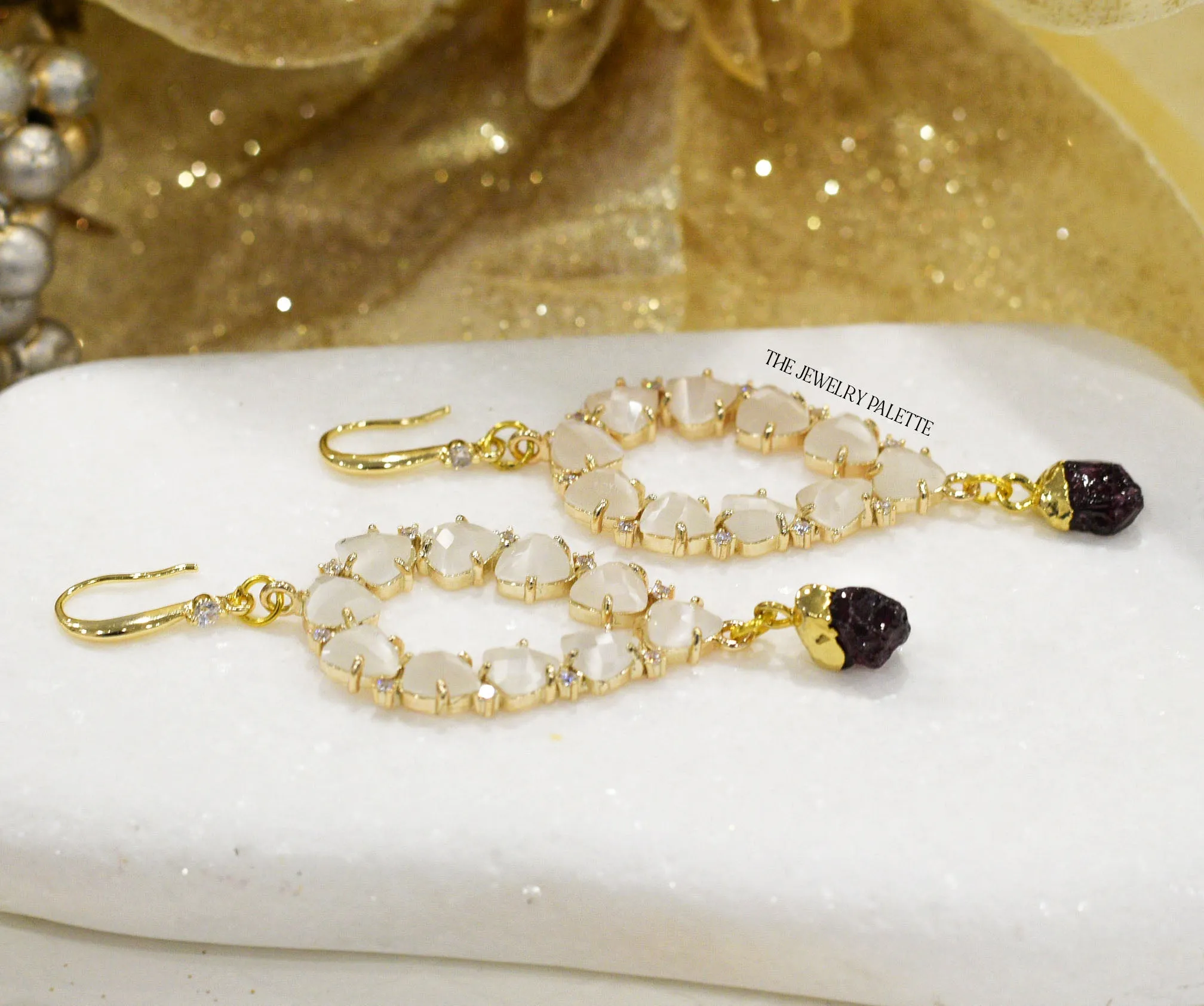 Yara white stones with gold edged garnet drop earrings