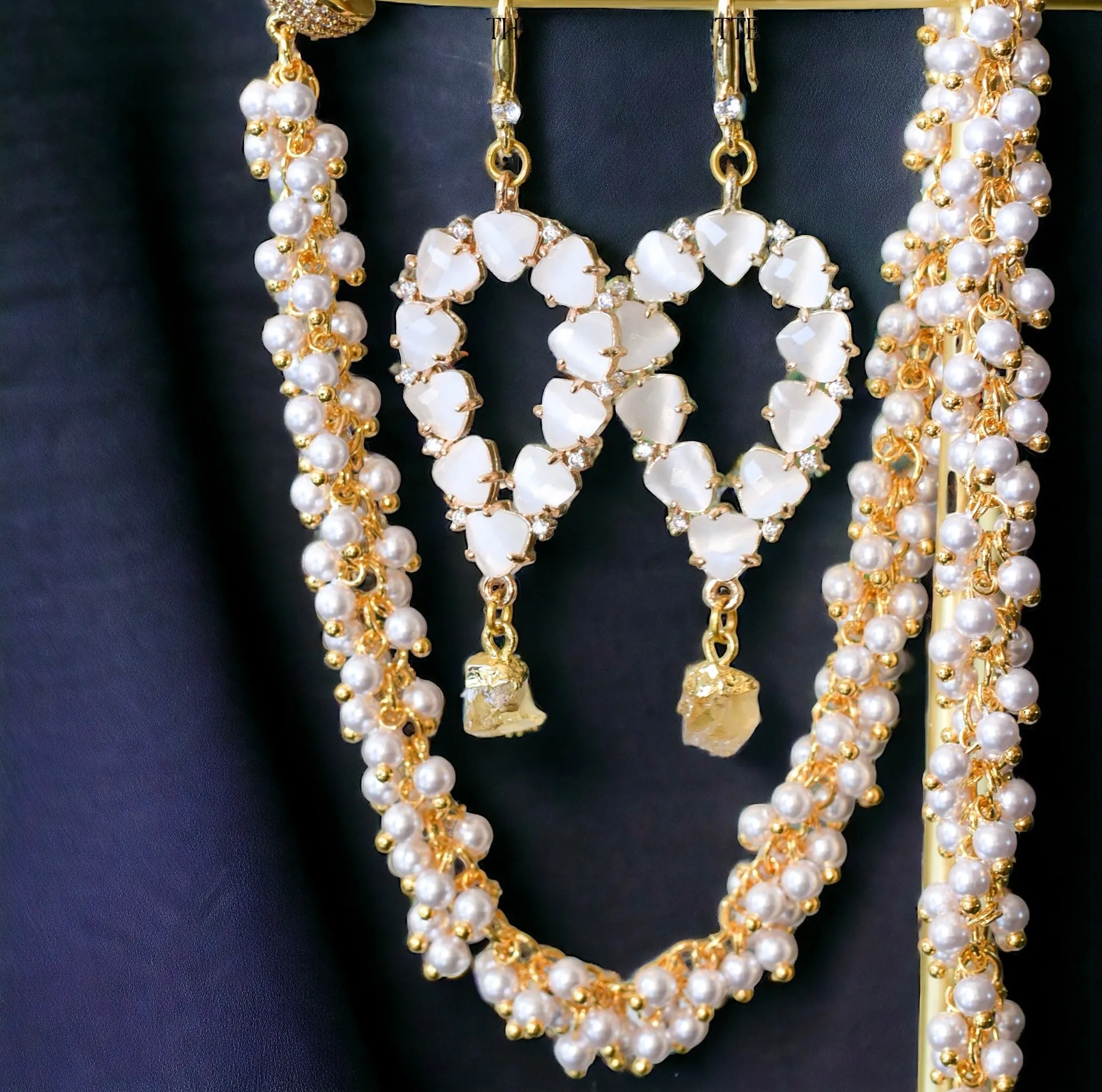 Yara white stones with gold edged garnet drop earrings